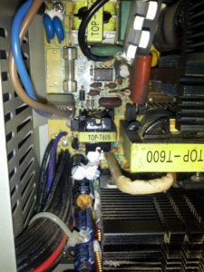 This is the top of the power supply.  Some of the caps are definitely exploded.