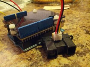 This is an Arduino Uno with a music shield and a proximity sensor.